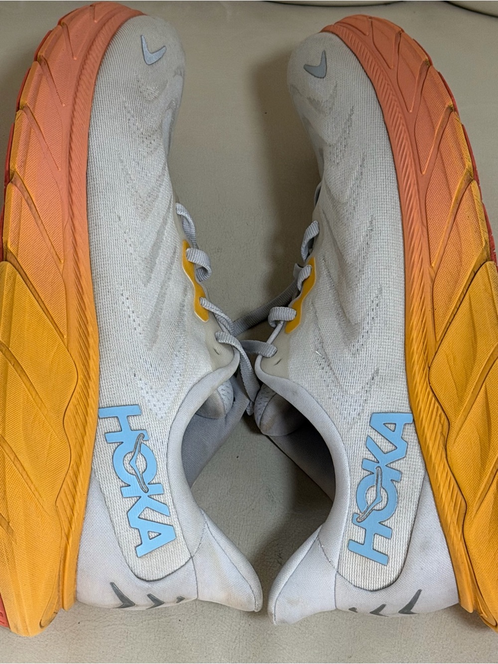 Hoka Men's White Running Shoes with Orange-to-Yellow Gradient Midsole